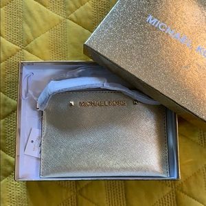 Michael Kors gold wristlet